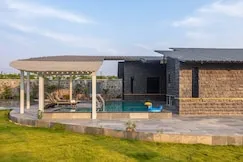 Pergola, pool and open lawn by day — PN Nature's Paradise Villa, Igatpuri