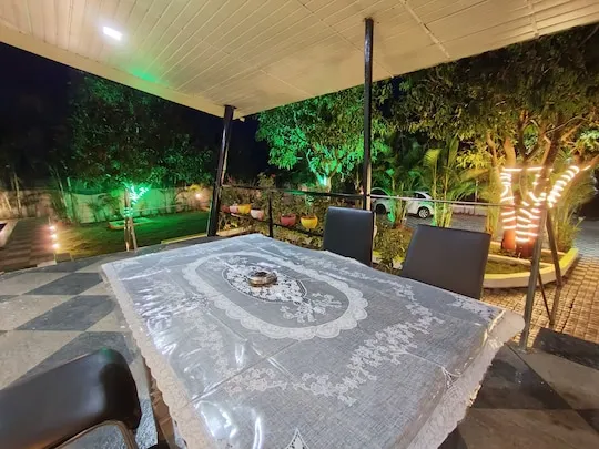 Covered dining area for home-style meals at PN Nature's Paradise Villa, Igatpuri