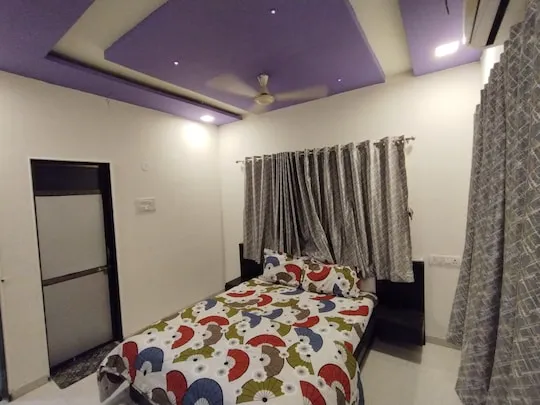 Pool Vista Suite — a king bedroom at PN Nature's Paradise Villa, Igatpuri