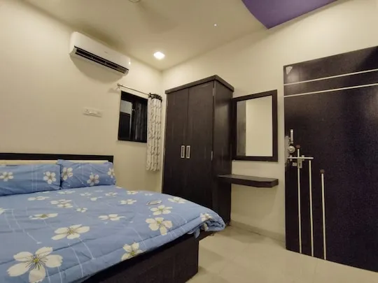 King bedroom with air-conditioning and wardrobe at PN Nature's Paradise Villa, Igatpuri
