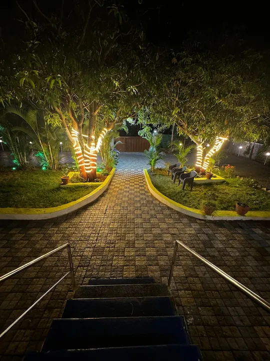 Garden pathway from the villa steps — PN Nature's Paradise Villa, Igatpuri