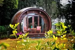 Private garden pod with seating for two at PN Nature's Paradise Villa, Igatpuri